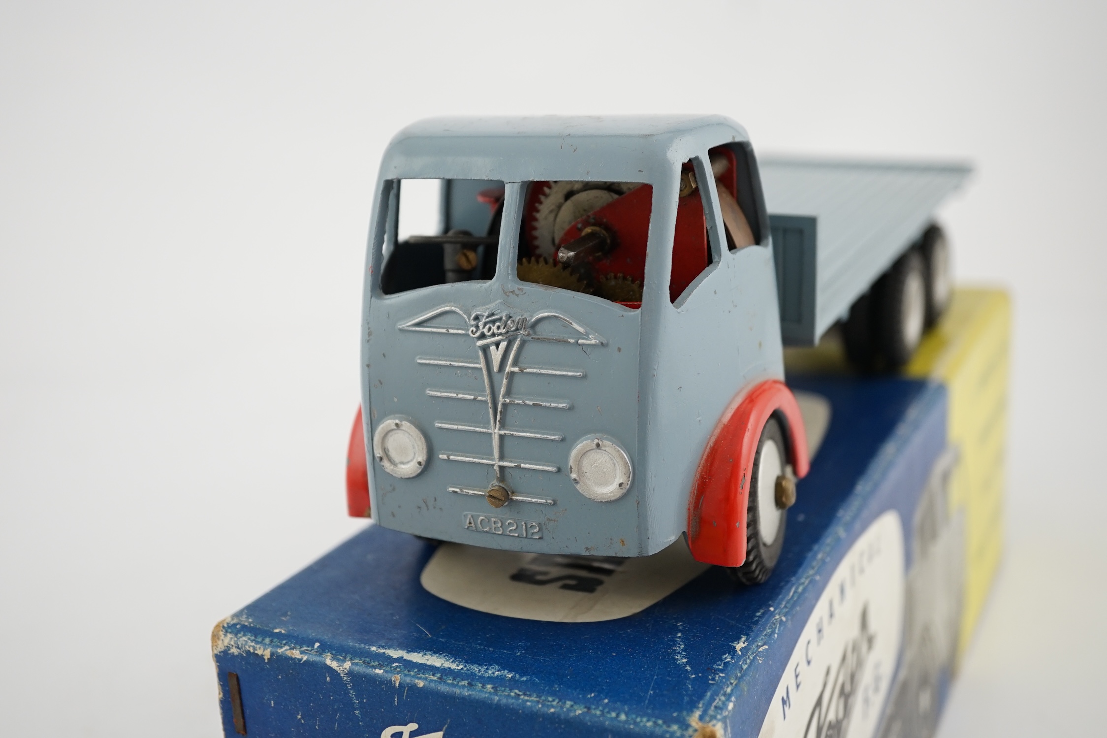 A boxed Shackleton Toy Foden FG flatbed lorry in smoke grey, with both keys, in the correct colour coded box